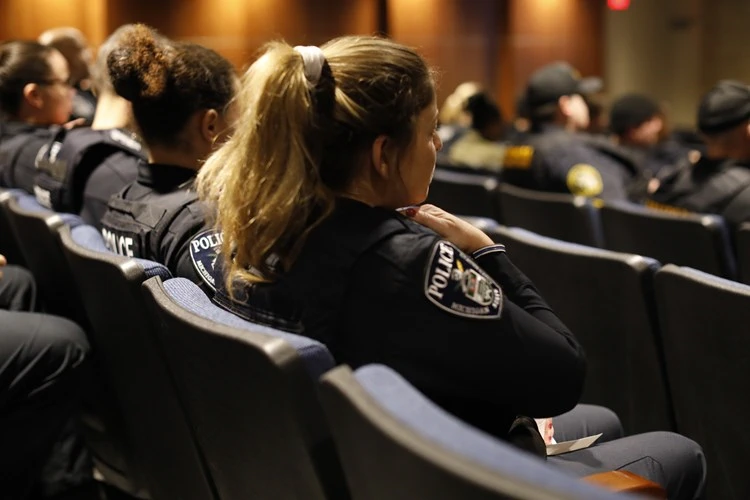 Officers sitting in auditorium